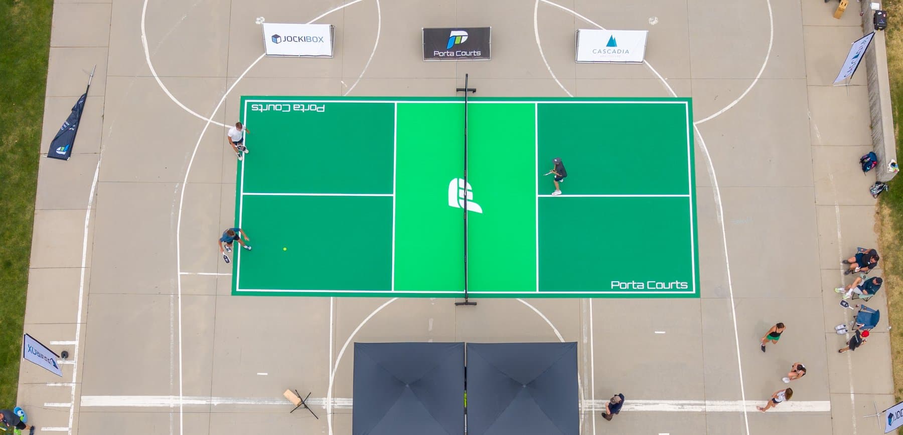 Aerial view of green PortaCourt with players