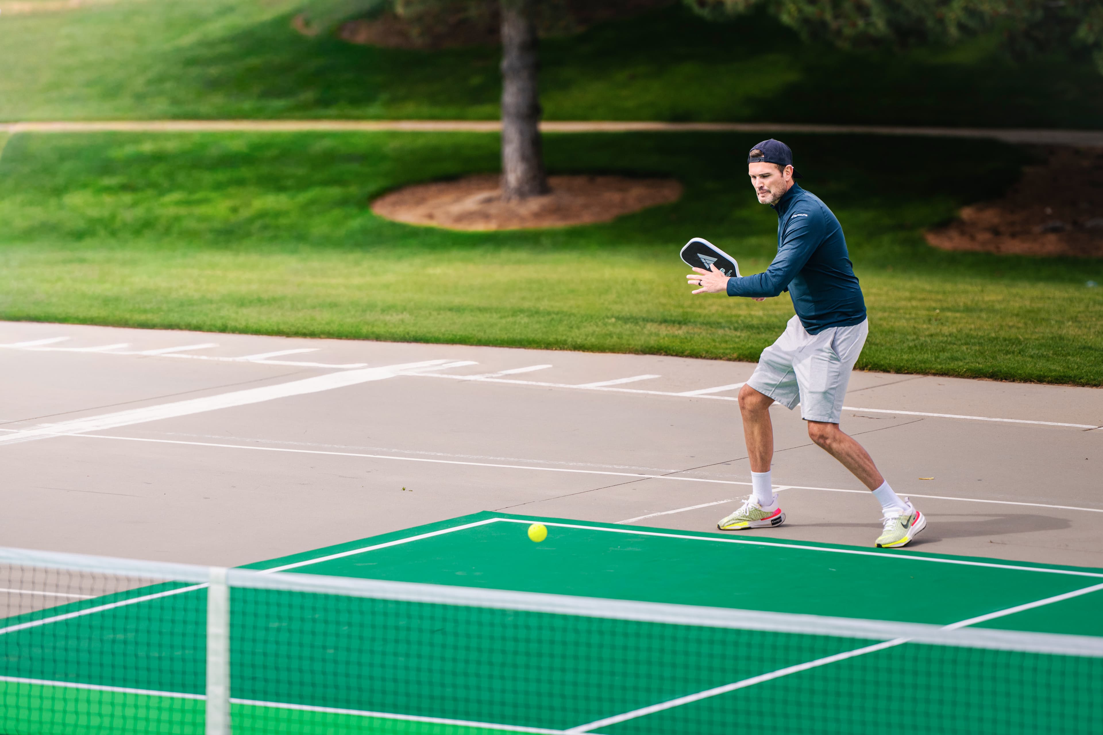Player hitting a shot on a green PortaCourt
